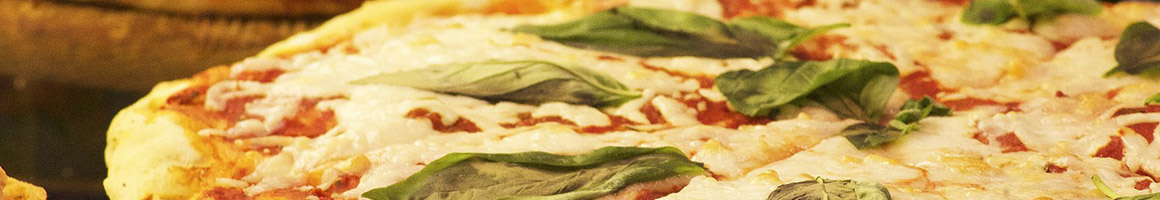 Eating Italian Pizza at Dicastro's Brick Oven restaurant in Rome, NY.